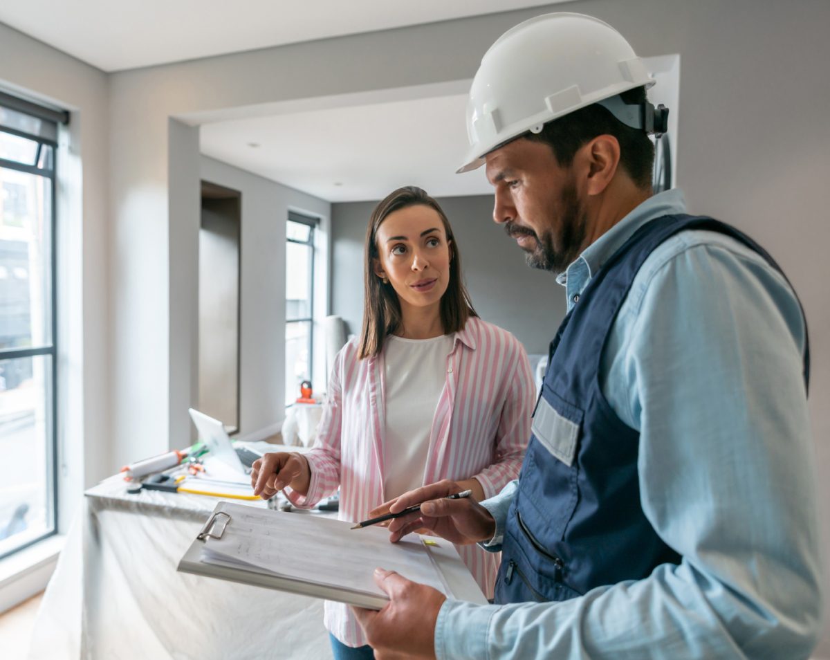 Construction meeting between woman and man