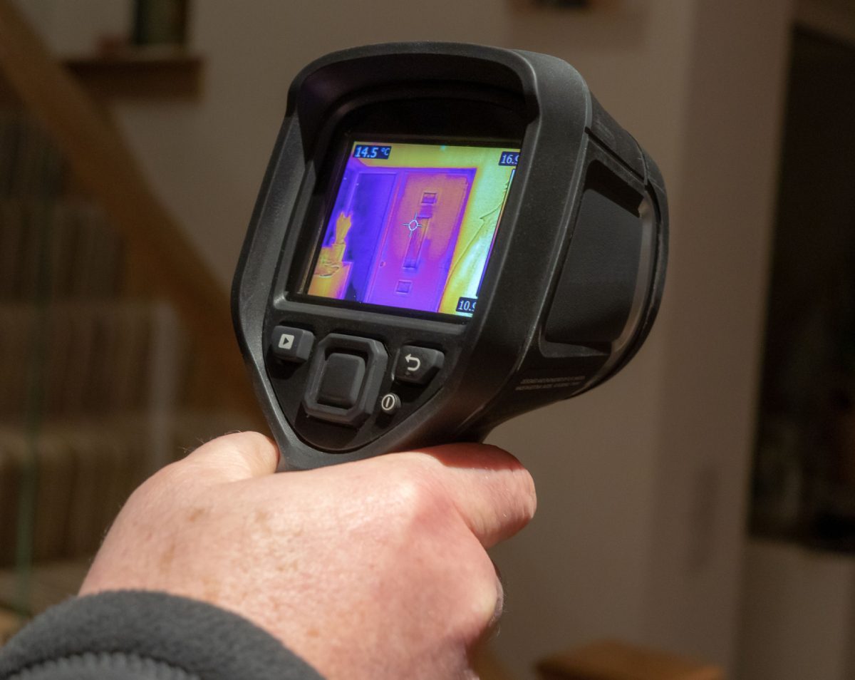 Hand holding a thermal imaging device
